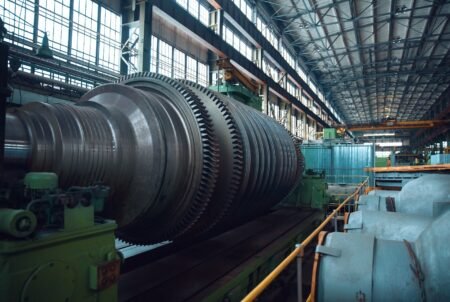 Turbine manufacturing factory, gears, nobody. Power machines, plant interior on background, industrial machinery